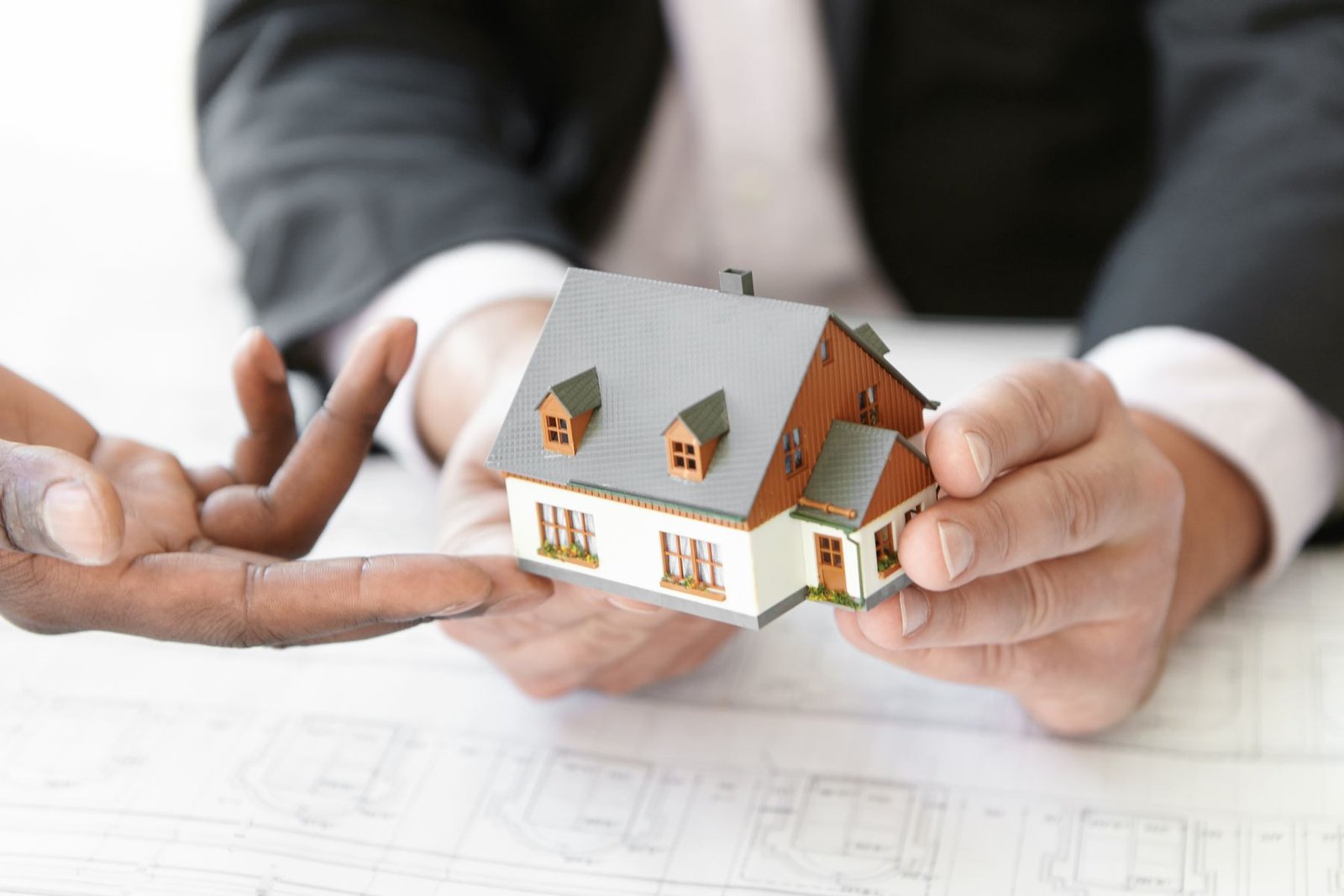 Engineers reviewing a housing project design together